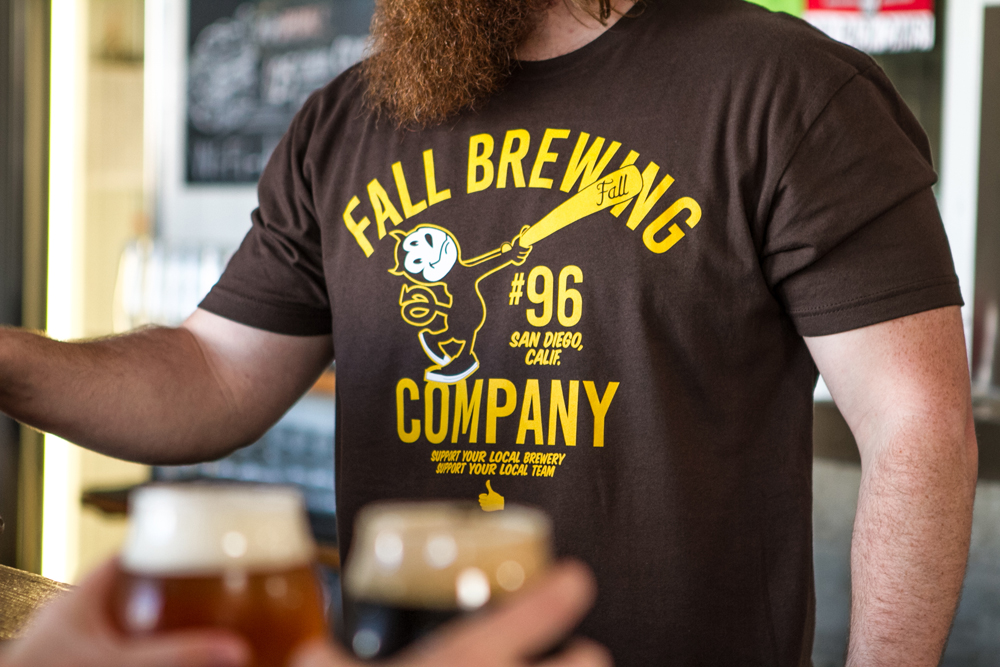 Brown Sports Ball Shirt Being worn by a beertender
